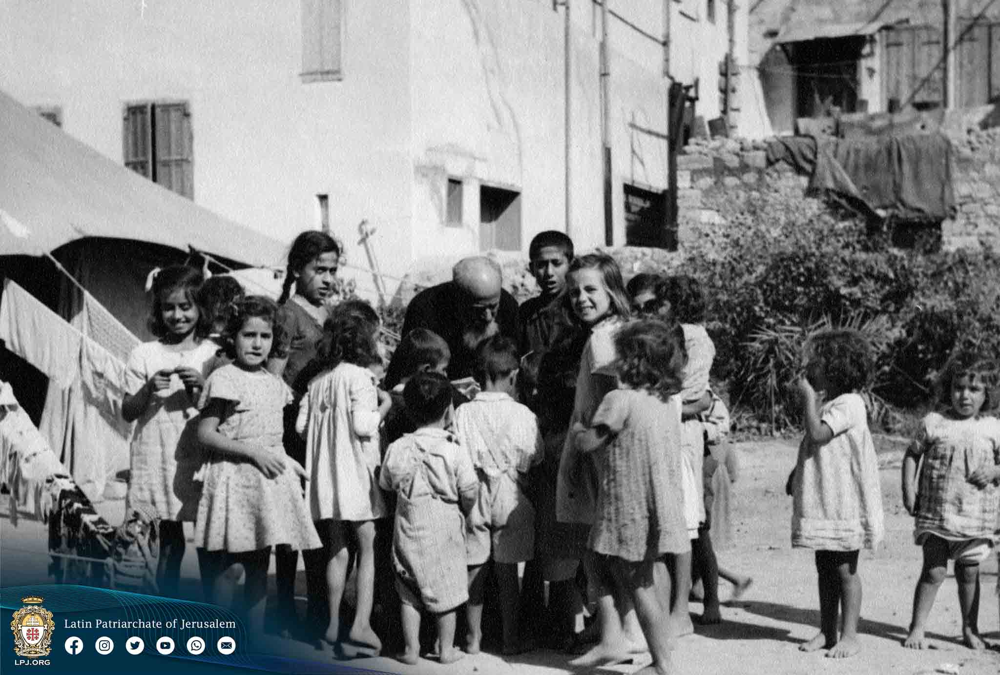 Refugees with the parish priest in 1948